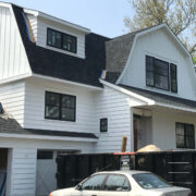 Custom home board and batten siding with PVC trim and moulding